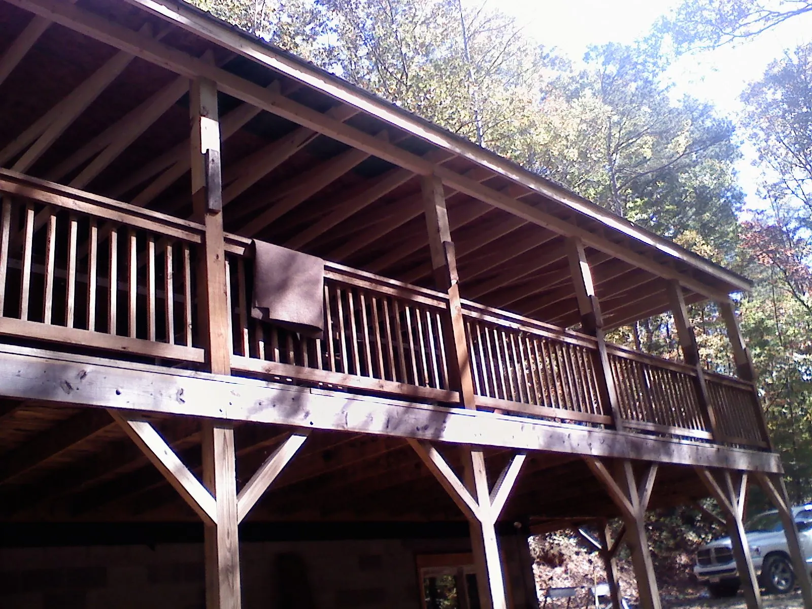 Timber framing under a new elevated porch and deck — Roof Leak Repair in Dime Box by Roofing Brothers